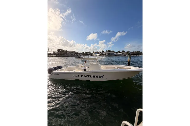 The Image of 2017 Invincible 39 Open Fisherman boat on water under a partly cloudy sky. - 0