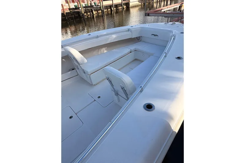 Slide: The Image of 2017 Invincible 39 Open Fisherman boat interior with white seating and spacious deck. - 12