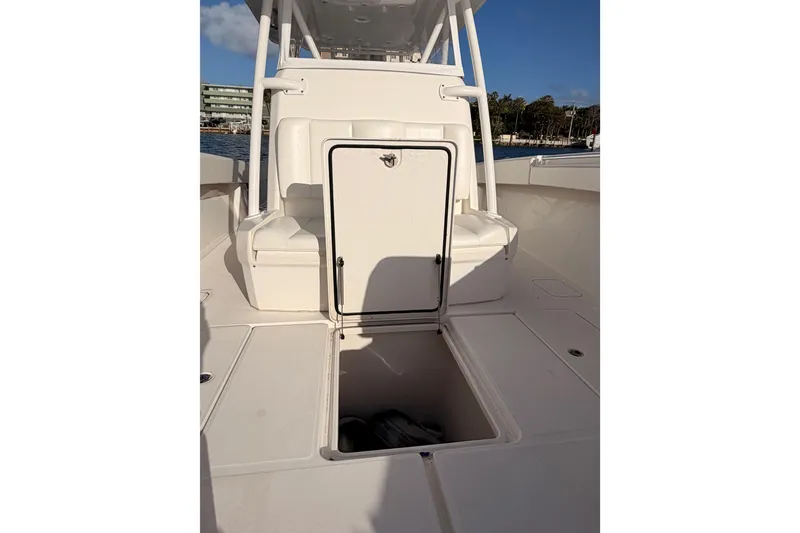 Slide: The Image of 2017 Invincible 39 Open Fisherman boat interior with open storage compartment. - 17