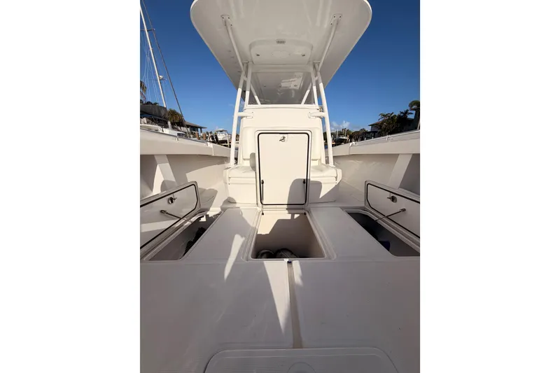 Slide: The Image of 2017 Invincible 39 Open Fisherman boat interior with storage compartments open. - 18