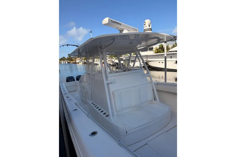 Slide: The Image of 2017 Invincible 39 Open Fisherman boat docked, featuring sleek design and advanced navigation equipment. - 19