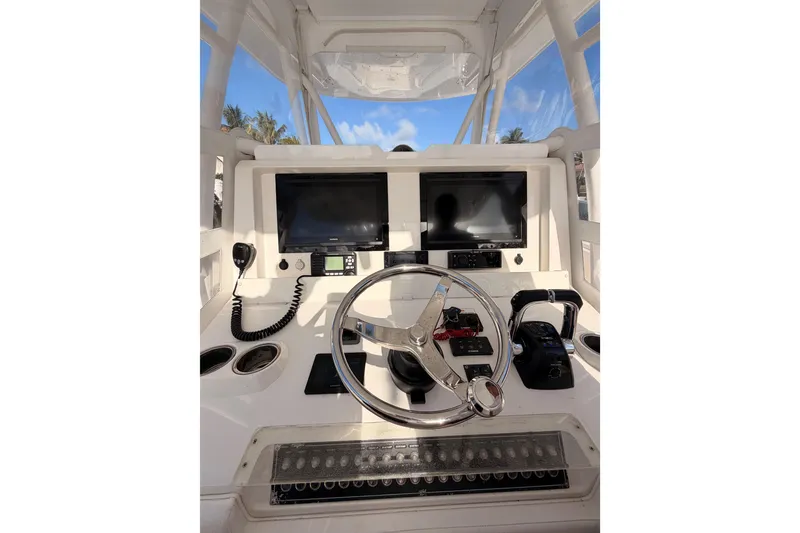 Slide: The Image of Helm of 2017 Invincible 39 Open Fisherman with dual screens and steering wheel. - 21