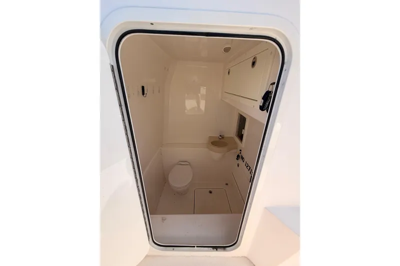 Slide: The Image of Interior view of 2017 Invincible 39 Open Fisherman boat's compact bathroom. - 26