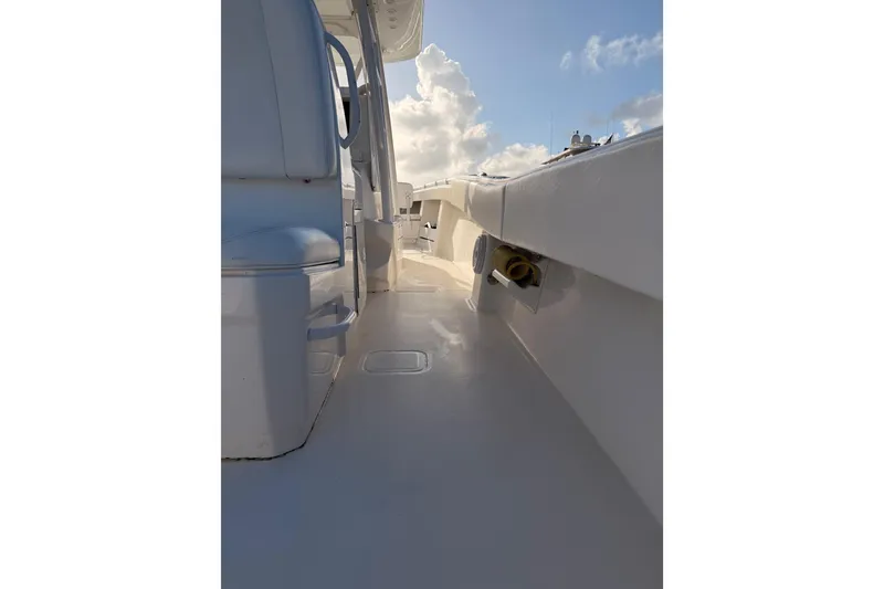 Slide: The Image of 2017 Invincible 39 Open Fisherman boat deck under a bright blue sky. - 27