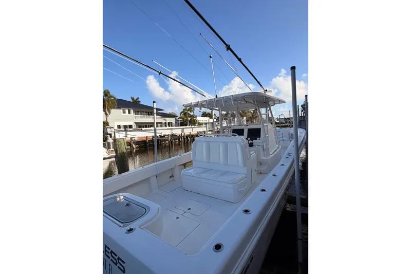 Slide: The Image of 2017 Invincible 39 Open Fisherman boat docked, featuring spacious seating and modern design. - 28