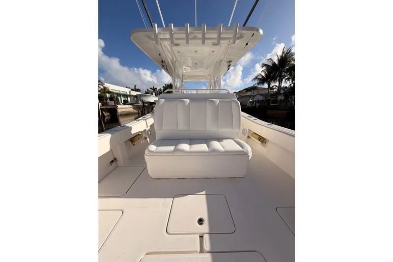 Slide: The Image of 2017 Invincible 39 Open Fisherman boat with white seating and clear blue sky. - 29