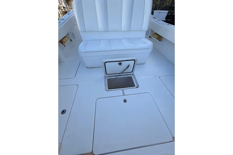 Slide: The Image of 2017 Invincible 39 Open Fisherman boat interior with white seating and storage compartments. - 30