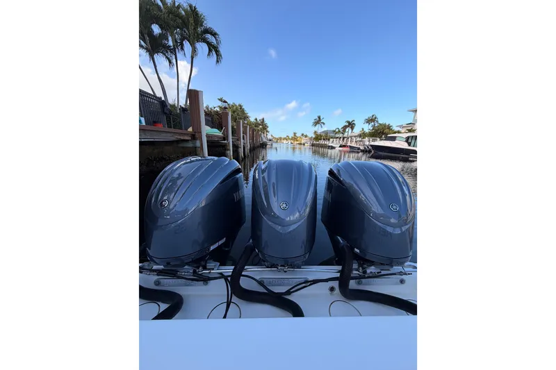 Slide: The Image of Triple Yamaha outboard engines on a 2017 Invincible 39 Open Fisherman boat. - 33