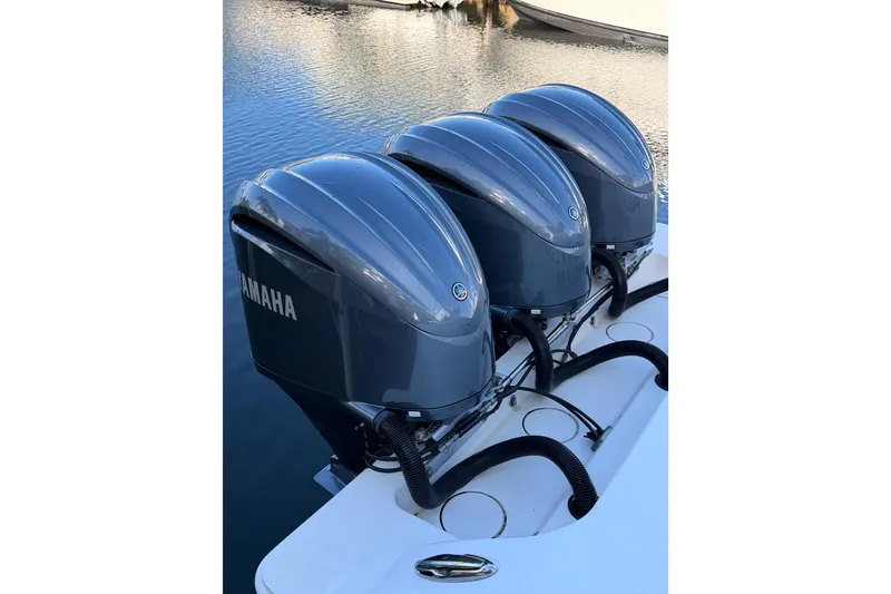 Slide: The Image of Triple Yamaha outboard engines on a 2017 Invincible 39 Open Fisherman boat. - 34