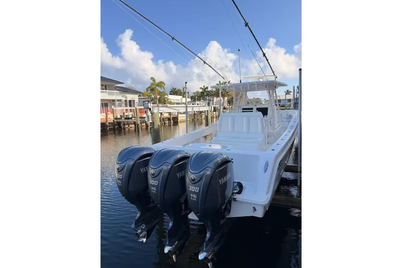 Slide: The Image of 2017 Invincible 39 Open Fisherman boat with triple Yamaha 300 V6 engines docked. - 35