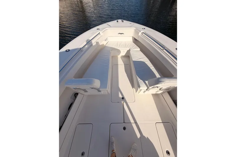 Slide: The Image of 2017 Invincible 39 Open Fisherman boat interior with white seating and deck. - 8