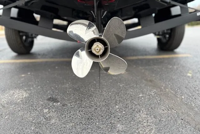 Slide: The Image of 2026 Tahoe T18 boat propeller on a trailer in a parking lot. - 74