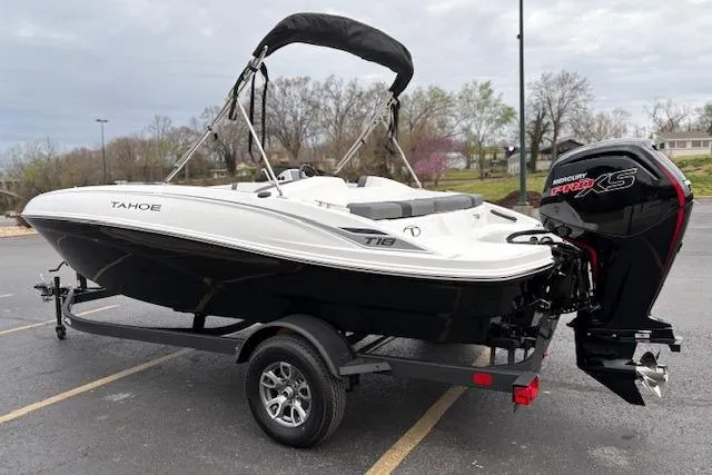 Slide: The Image of 2026 Tahoe T18 boat with Mercury engine on trailer in parking lot. - 77