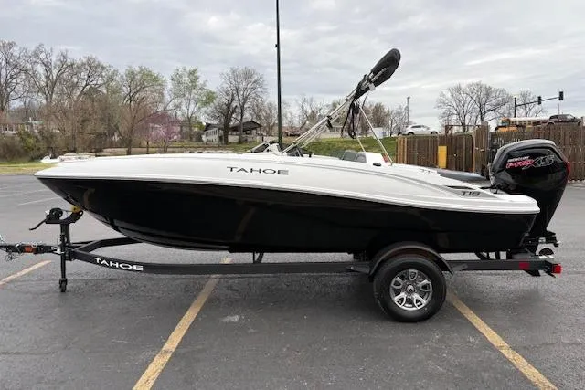Slide: The Image of 2026 Tahoe T18 boat on trailer in parking lot, side view. - 78