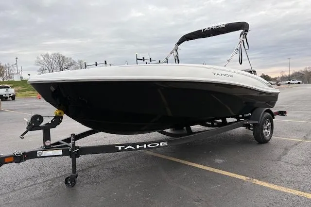 Slide: The Image of 2026 Tahoe T18 boat on trailer in parking lot, overcast sky. - 81