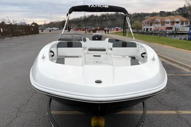 Slide: The Image of 2026 Tahoe T18 boat with sleek design, parked on a lakeside road. - 84