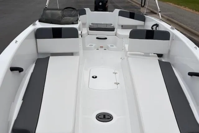 Slide: The Image of 2026 Tahoe T18 boat interior with gray and white seating, spacious layout. - 85