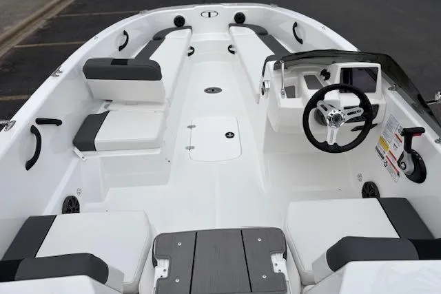 Slide: The Image of 2026 Tahoe T18 boat interior with modern seating and steering console. - 89