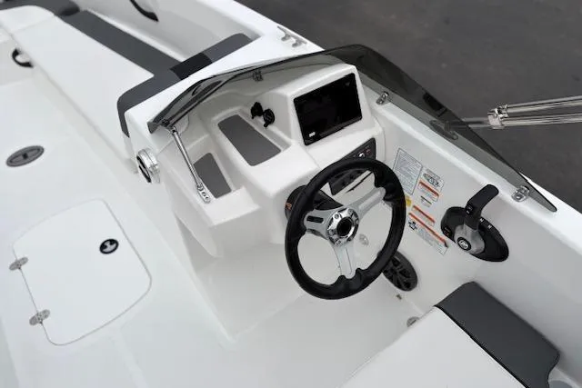 Slide: The Image of Cockpit of 2026 Tahoe T18 boat with steering wheel and control panel. - 90