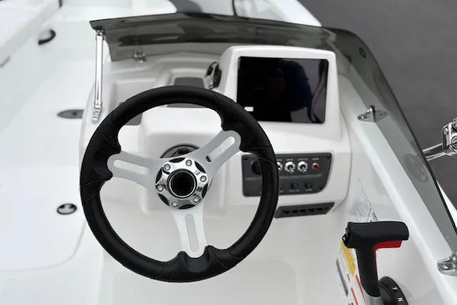 Slide: The Image of Steering console of 2026 Tahoe T18 boat with modern controls and display. - 97