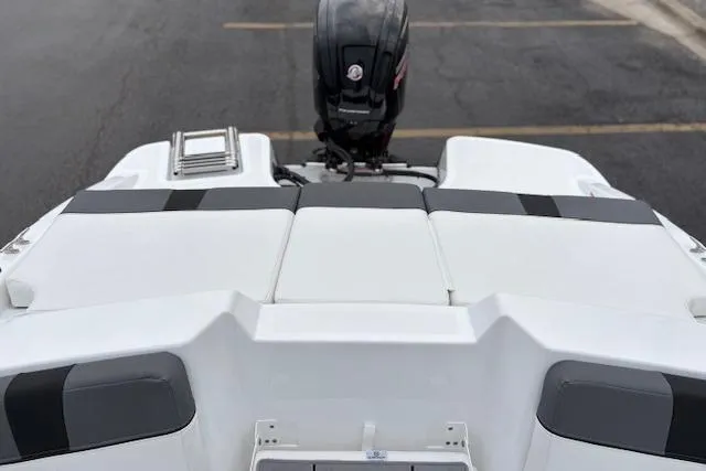 Slide: The Image of 2026 Tahoe T18 boat rear view with outboard motor and sleek white design. - 98