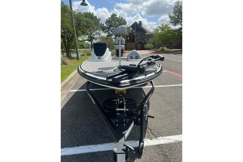Slide: The Image of 2026 Nitro Z17 boat on trailer in parking lot, under a partly cloudy sky. - 4