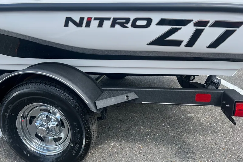 Slide: The Image of 2026 Nitro Z17 boat trailer with chrome wheel and logo detail. - 2