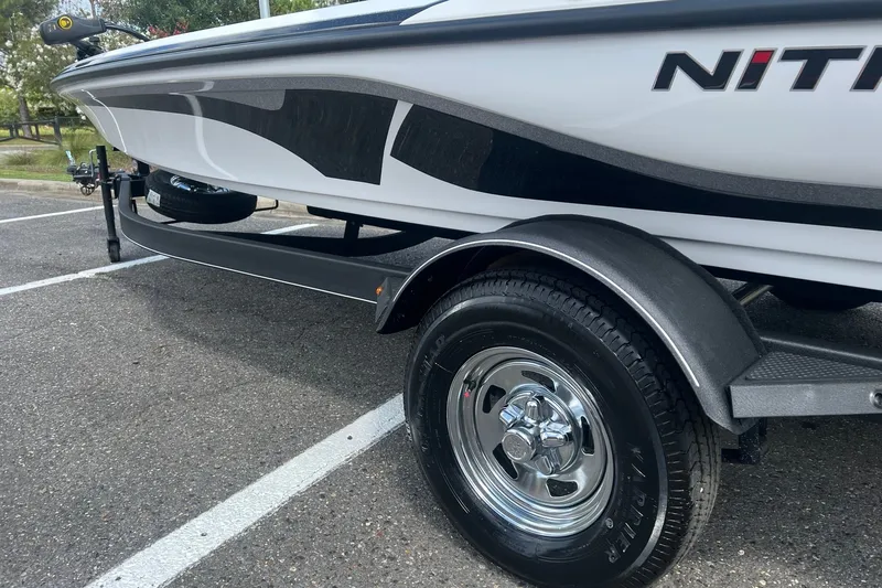 Slide: The Image of 2026 Nitro Z17 boat on trailer, showcasing sleek design and shiny wheels. - 3