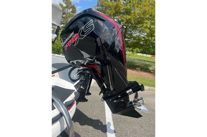 Slide: The Image of 2026 Nitro Z17 boat with Mercury Pro XS outboard motor, parked outdoors. - 7