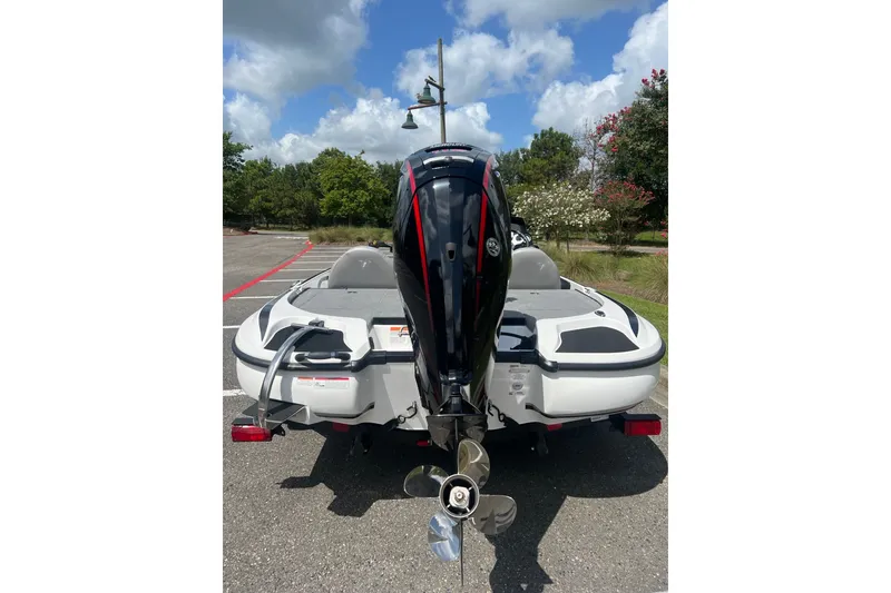 Slide: The Image of 2026 Nitro Z17 boat with powerful outboard motor, parked on a sunny day. - 8