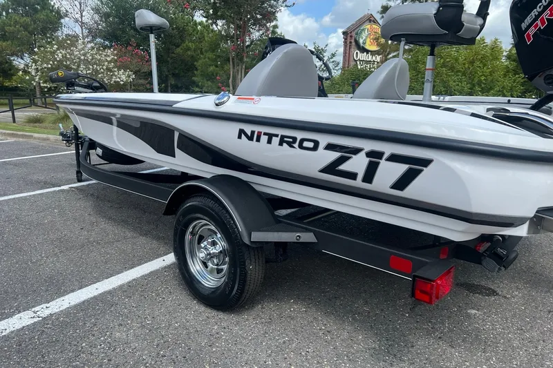 Slide: The Image of 2026 Nitro Z17 boat on trailer in parking lot, featuring sleek design and modern features. - 1