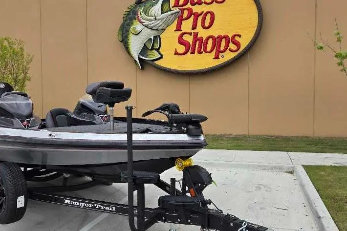 Slide: The Image of 2025 Ranger Z518 boat on trailer outside Bass Pro Shops store. - 8
