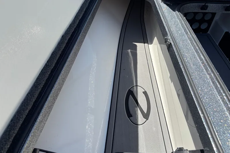 Slide: The Image of 2025 Ranger Z518 boat storage compartment with sleek interior design. - 11