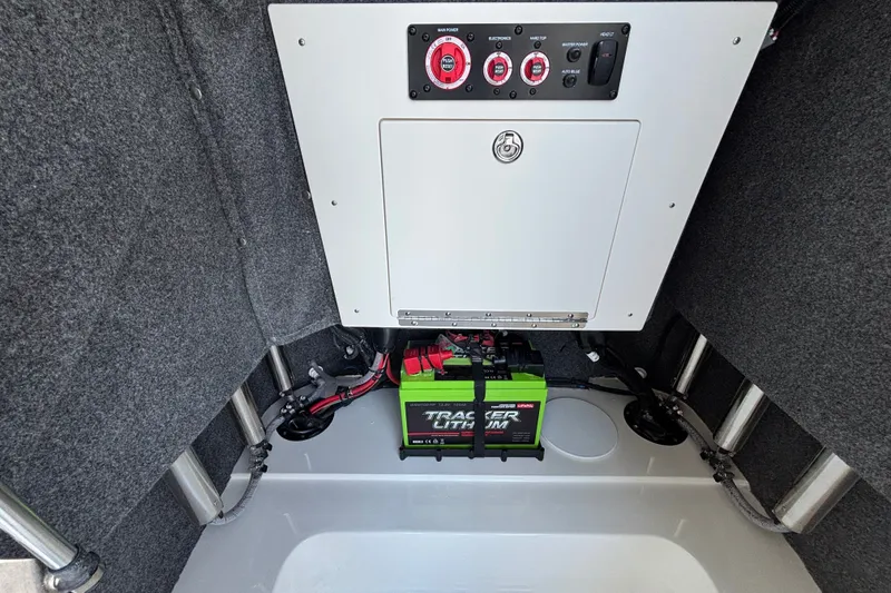 Slide: The Image of Electrical panel and battery setup in 2026 Mako 24 APEX boat interior. - 14