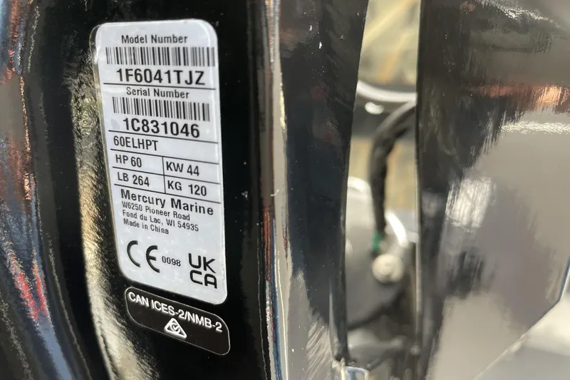 Slide: The Image of Label on Tracker Grizzly 1756 T Marsh 2026, displaying model and serial numbers. - 68