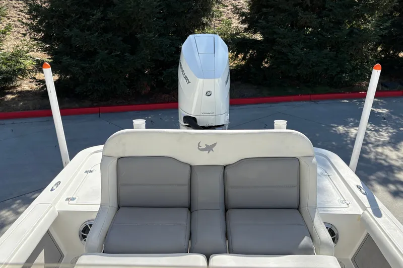 Slide: The Image of 2026 Mako 24 APEX boat with Mercury engine, featuring comfortable seating and sleek design. - 22