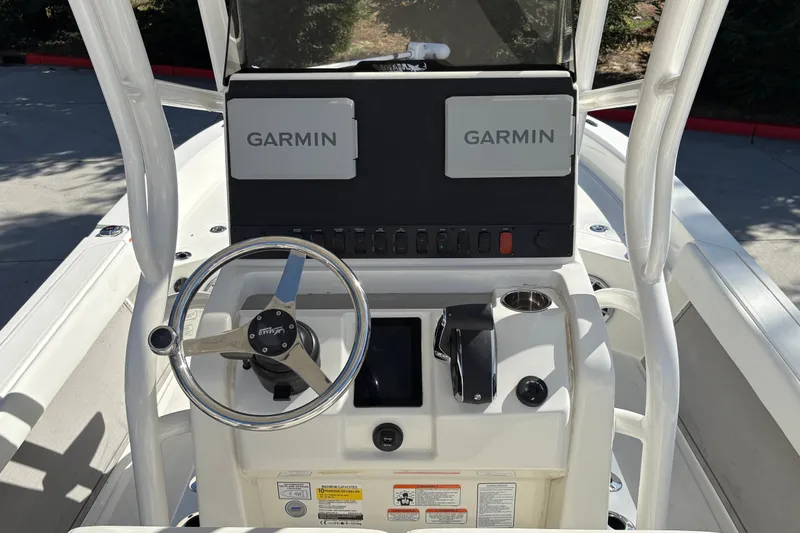 Slide: The Image of Center console of 2026 Mako 24 APEX boat with Garmin navigation system. - 16