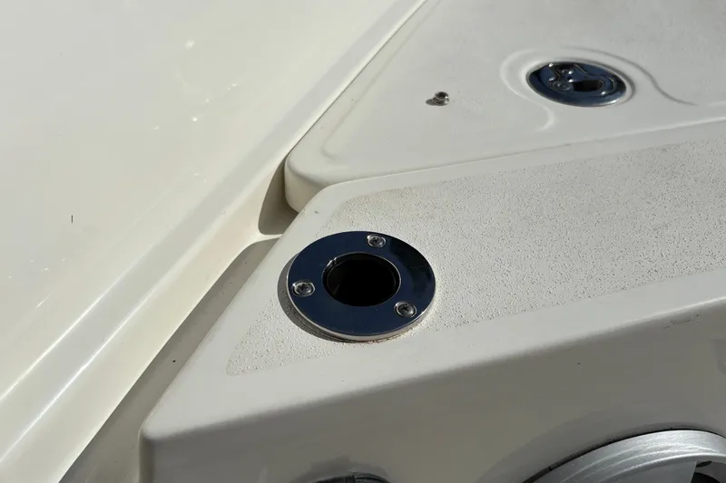 Slide: The Image of Close-up of 2026 Mako 24 APEX boat deck with metal fittings. - 20