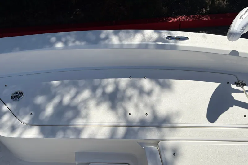 Slide: The Image of 2026 Mako 24 APEX boat deck with shadows and sleek design elements. - 42