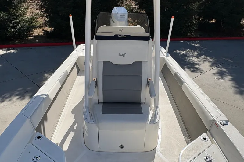 Slide: The Image of 2026 Mako 24 APEX boat interior with sleek seating and modern design. - 31