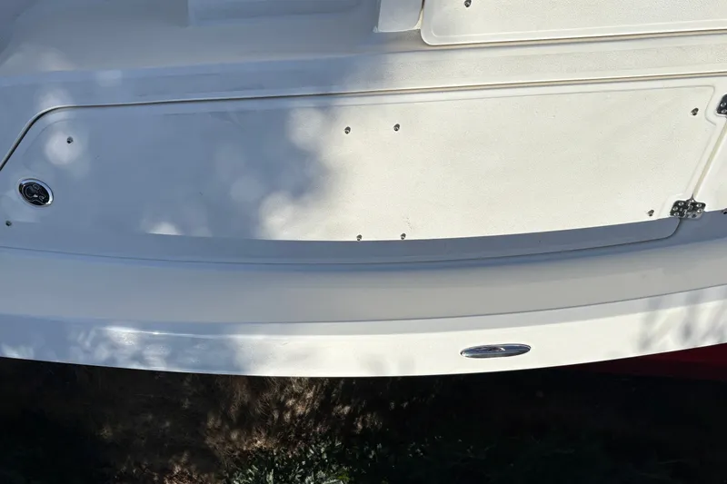 Slide: The Image of 2026 Mako 24 APEX boat deck, featuring sleek white design and stainless steel accents. - 12