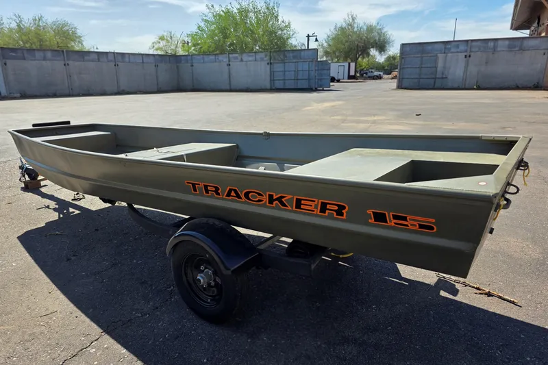 The Image of 2026 Tracker Grizzly 15 Jon boat on trailer in outdoor setting. - 0