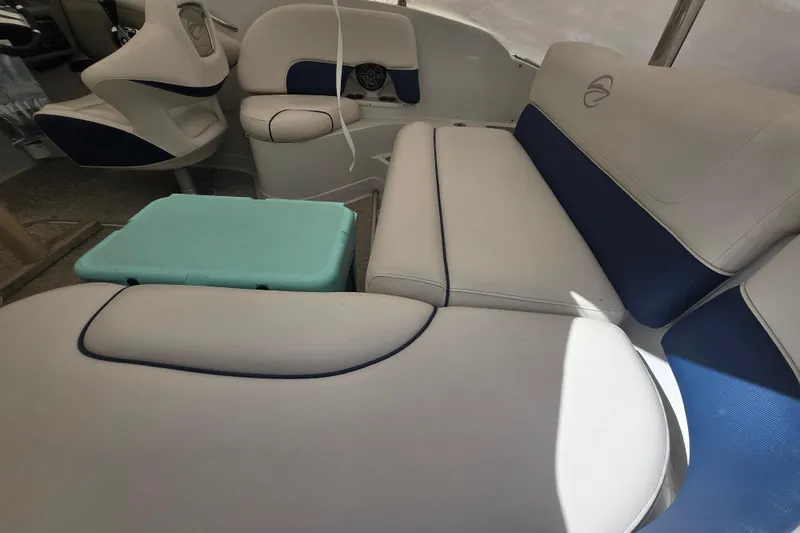 Slide: The Image of Interior of 2017 Crownline Eclipse E2 XS boat with white and blue seating. - 10