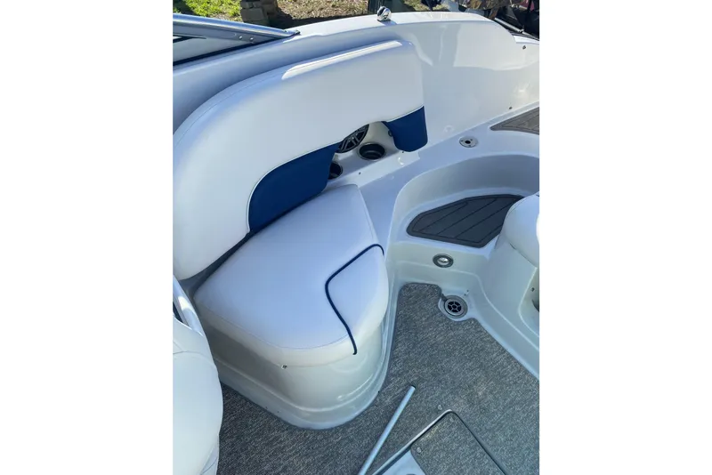 Slide: The Image of 2017 Crownline Eclipse E2 XS boat interior with white and blue seating. - 12