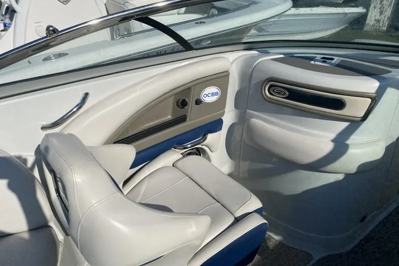 Slide: The Image of Interior of 2017 Crownline Eclipse E2 XS boat with white seating and dashboard. - 5