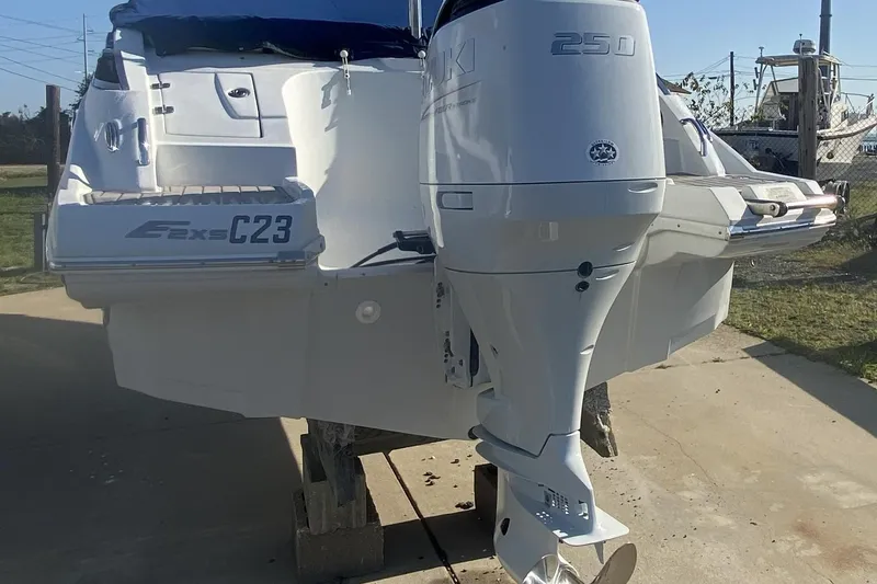 Slide: The Image of 2017 Crownline Eclipse E2 XS boat with Suzuki 250 outboard motor, docked outdoors. - 8