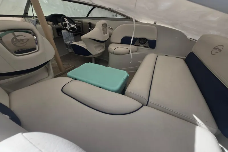 Slide: The Image of 2017 Crownline Eclipse E2 XS boat interior with plush seating and modern steering console. - 9