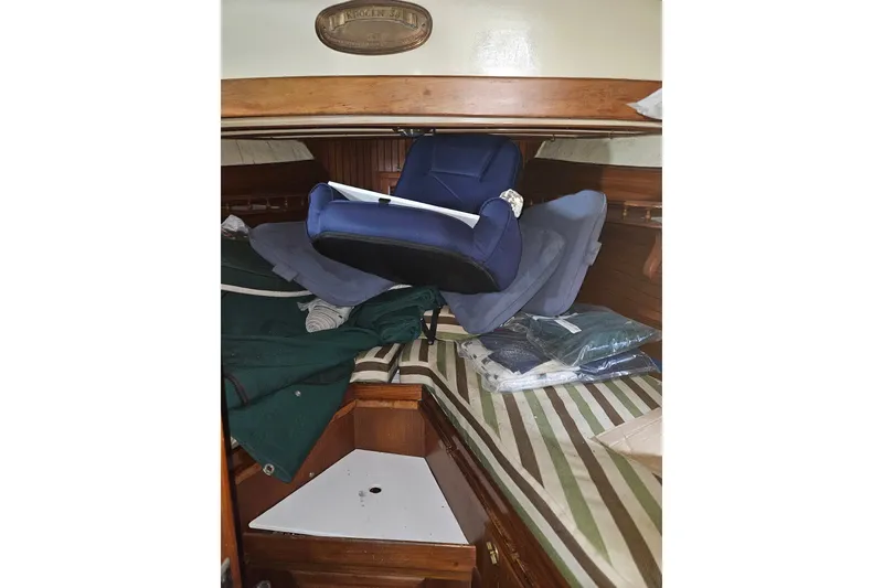 Slide: The Image of Interior of 1982 Kadey-Krogen 38 boat with cushions and storage area. - 21