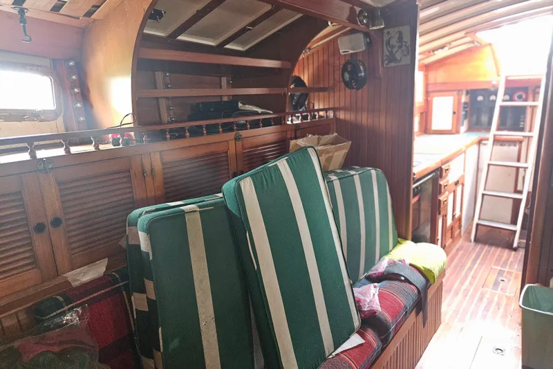 Slide: The Image of Interior of 1982 Kadey-Krogen 38 yacht with wooden cabinetry and striped cushions. - 17