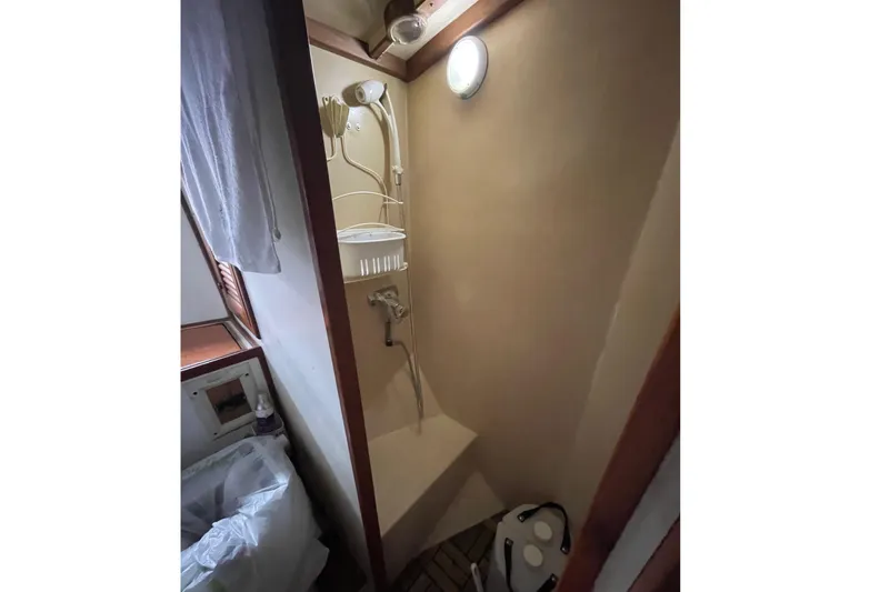 Slide: The Image of Compact shower area in a 1982 Kadey-Krogen 38 Dual Centerboard yacht. - 22